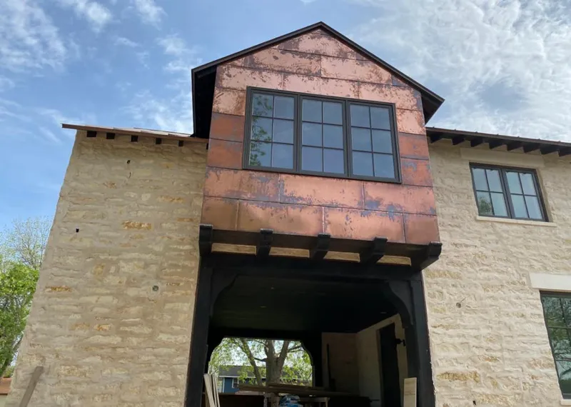 Copper metal panel facade on a stone building for Metal Roof Coating in Bealeton